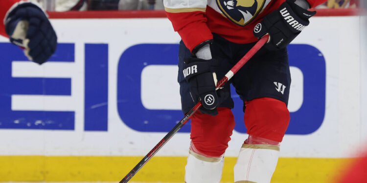 May 11, 2025; Sunrise, Florida, USA; Florida Panthers defenseman Aaron Ekblad (5) skates with the puck against the Toronto Maple Leafs during the first period in game four of the second round of the 2025 Stanley Cup Playoffs at Amerant Bank Arena. Mandatory Credit: Kim Klement Neitzel-Imagn Images