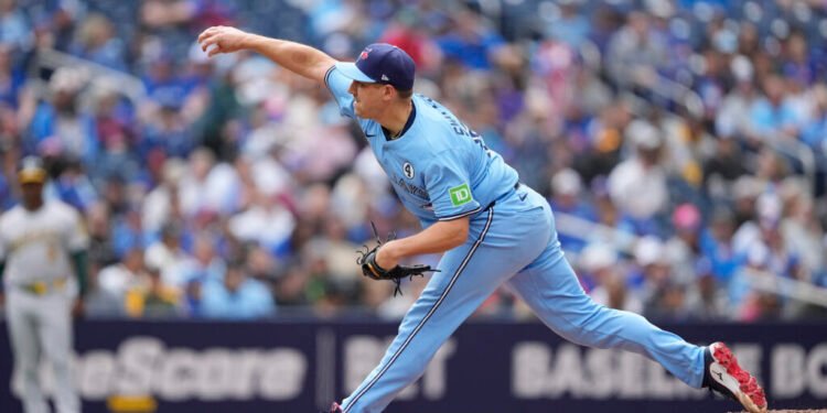 Jun 1, 2025; Toronto, Ontario, CAN; Toronto Blue Jays pitcher Erik Swanson (50) pitches to the Athletics during the eighth inning at Rogers Centre. Mandatory Credit: John E. Sokolowski-Imagn Images