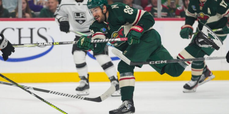 Oct 19, 2023; Saint Paul, Minnesota, USA; Minnesota Wild center Frederick Gaudreau (89) shoots against the Los Angeles Kings in the first period at Xcel Energy Center. Mandatory Credit: Matt Blewett-USA TODAY Sports