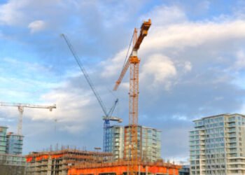 Construction cranes and development dominates the Vancouver, Canada skyline.