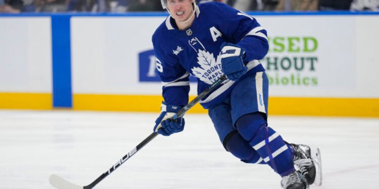 Mar 19, 2025; Toronto, Ontario, CAN; Toronto Maple Leafs forward Mitch Marner (16) skates against the Colorado Avalanche during the third period at Scotiabank Arena. Mandatory Credit: John E. Sokolowski-Imagn Images