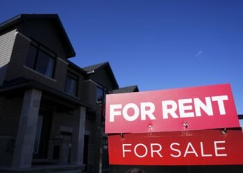 A for-rent and a for-sale sign are displayed on a house in a new housing development in Ottawa on Friday, Oct. 14, 2022. The national average asking rent in May was down 3.3 per cent from a year earlier at $2,129, marking the eighth consecutive month of year-over-year decreases. THE CANADIAN PRESS/Sean Kilpatrick