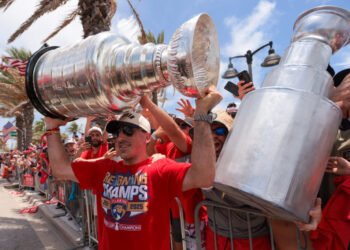 Jun 22, 2025; Fort Lauderdale, Florida, UNITED STATES; Florida Panthers center Brad Marchand (63) celebrates with the Stanley Cup during the Stanley Cup championship parade and rally. Mandatory Credit: Sam Navarro-Imagn Images