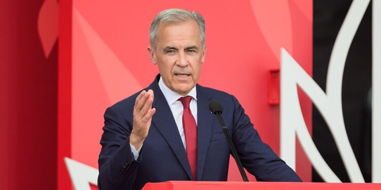 Mark Carney, Canada's prime minister, speaks at LeBreton Flats on Canada Day in Ottawa, Ontario, Canada, on Tuesday, July 1, 2025. Canada Day, which has been celebrated since 1868, also coincides this year with the 60th anniversary of the Canadian flag. Photographer: James Park/Bloomberg via Getty Images