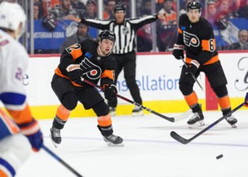 Apr 12, 2025; Philadelphia, Pennsylvania, USA; Philadelphia Flyers left wing Jakob Pelletier (22) watches the puck against the New York Islanders in the second period at Wells Fargo Center. Mandatory Credit: Kyle Ross-Imagn Images