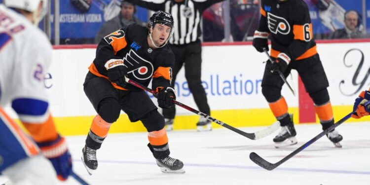 Apr 12, 2025; Philadelphia, Pennsylvania, USA; Philadelphia Flyers left wing Jakob Pelletier (22) watches the puck against the New York Islanders in the second period at Wells Fargo Center. Mandatory Credit: Kyle Ross-Imagn Images