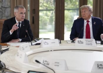President Donald Trump, right, and Canada's Prime Minister Mark Carney participate in a session of the G7 Summit, Monday, June 16, 2025, in Kananaskis, Canada. (AP Photo/Mark Schiefelbein)