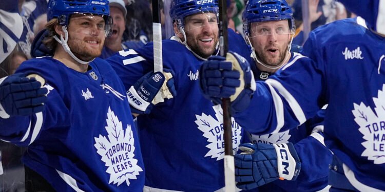 May 5, 2025; Toronto, Ontario, CAN; Toronto Maple Leafs forward William Nylander (88) celebrates with defenseman Morgan Rielly (44) and forward John Tavares (91) after his second goal of the first period against the Florida Panthers during the second round of the 2025 Stanley Cup Playoffs at Scotiabank Arena. Mandatory Credit: John E. Sokolowski-Imagn Images