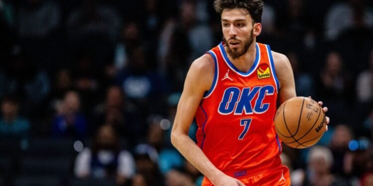 Apr 7, 2024; Charlotte, North Carolina, USA; Oklahoma City Thunder forward Chet Holmgren (7) brings the ball up court against the Charlotte Hornets at Spectrum Center. Mandatory Credit: Scott Kinser-USA TODAY Sports