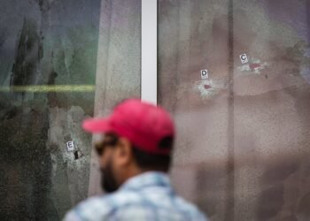 Bullet holes are seen in the windows of Kap's Cafe, in Surrey, B.C., on Thursday, July 10, 2025. THE CANADIAN PRESS/Darryl Dyck
