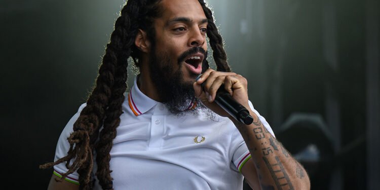 GLASTONBURY, ENGLAND - JUNE 28: Bobby Vylan of Bob Vylan performs on the West Holts stage during day four of Glastonbury festival 2025 at Worthy Farm, Pilton on June 28, 2025 in Glastonbury, England. Established by Michael Eavis in 1970, Glastonbury has grown into the UK's largest music festival, drawing over 200,000 fans to enjoy performances across more than 100 stages. In 2026, the festival will take a fallow year, a planned pause to allow the Worthy Farm site time to rest and recover. (Photo by Leon Neal/Getty Images)