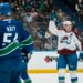 Nov 9, 2025; Vancouver, British Columbia, CAN; Vancouver Canucks forward Aatu Raty (54) and forward Kiefer Sherwood (44) react as Colorado Avalanche forward Nathan MacKinnon (29) celebrates his second goal of the game in the first period at Rogers Arena. Mandatory Credit: Bob Frid-Imagn Images