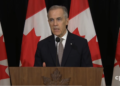 Canadian Prime Minister Mark Carney speaking to reporters in Sydney on Iran strikes