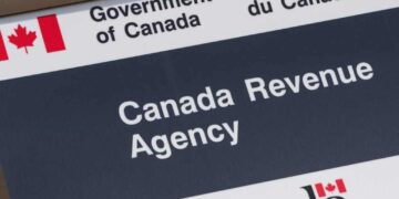 Canadian taxpayer reviewing documents amid rise in AI-driven tax scams during 2026 filing season