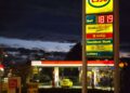 Gas station price sign showing rising fuel costs amid global oil market volatility