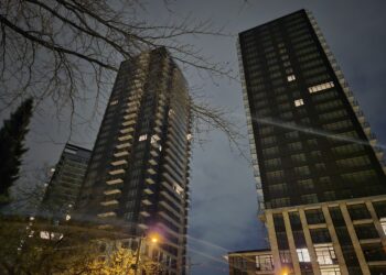 Canadian homeowner reviewing mortgage documents amid rising rates linked to Iran war