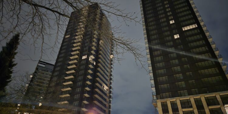 Iran War Drives Up Canadian Mortgage Rates and Inflation 1 Canadian homeowner reviewing mortgage documents amid rising rates linked to Iran war