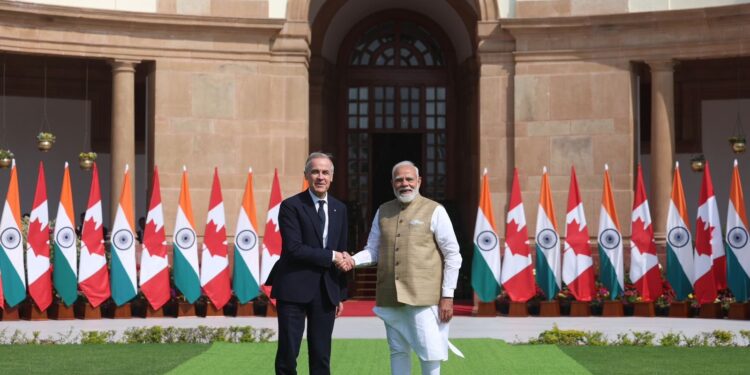 Canadian Prime Minister Mark Carney and Indian Prime Minister Narendra Modi shaking hands at Hyderabad House in New Delhi, symbolizing a historic reset and expansion of the Canada-India relationship