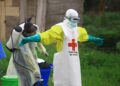 WHO Responds to Complex Ebola Outbreak in DR Congo 10 WHO health worker in protective gear during Ebola response in DR Congo