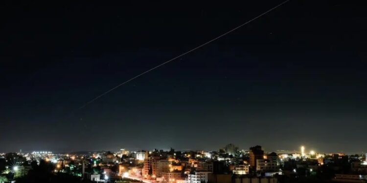 Missile launch representing Iran's attacks toward northern Israel amid escalating regional tensions