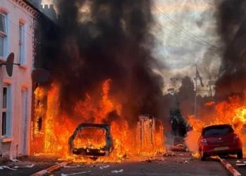 Belfast stabbing victim expected to wake from coma amid ongoing riots 2 Police officers facing rioters amid ongoing Belfast riots following stabbing attack