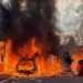 Police officers facing rioters amid ongoing Belfast riots following stabbing attack