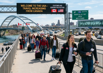 Canadian travelers at a U.S. airport amid rising cross-border trips in 2026