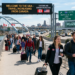 Canadian travelers at a U.S. airport amid rising cross-border trips in 2026