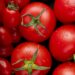 Fresh tomatoes in a grocery store reflecting soaring food prices in Canada